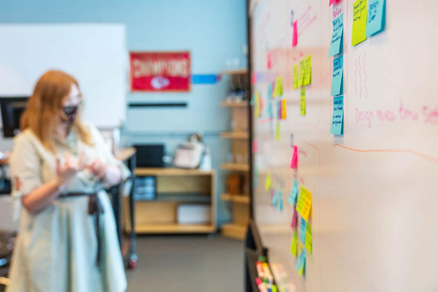 A photo from the Propaganda3 office showing a planning session, where a whiteboard has been written on and covered in sticky notes.