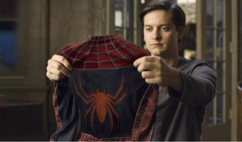 Peter Parker holding up his Spider-Man suit, representing the responsibility and power that comes with implementing strong Content-Security-Policy.