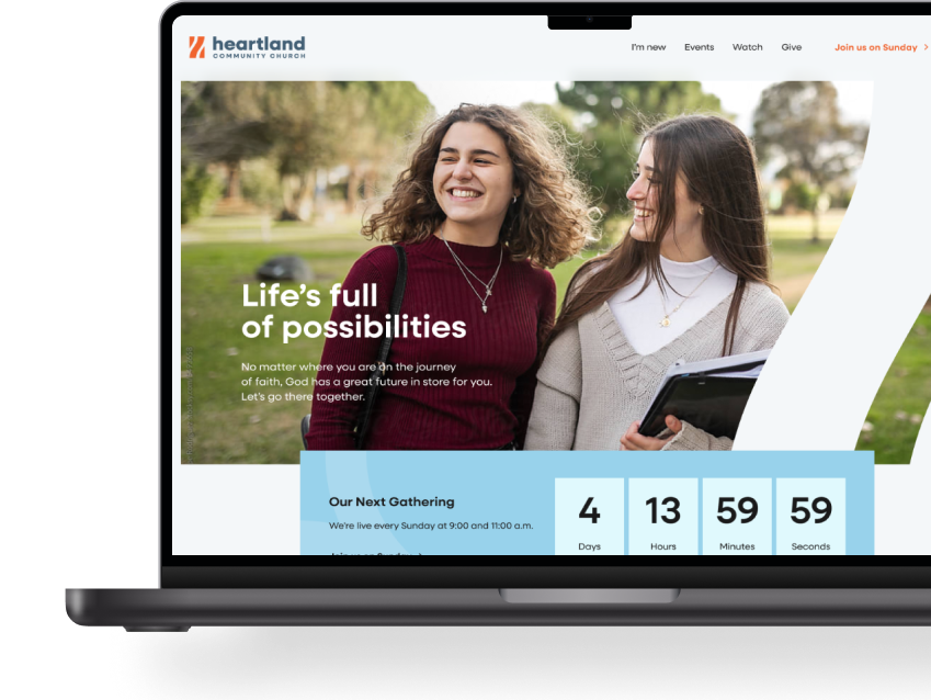 A mockup showing Heartland Community Church's homepage on a laptop.