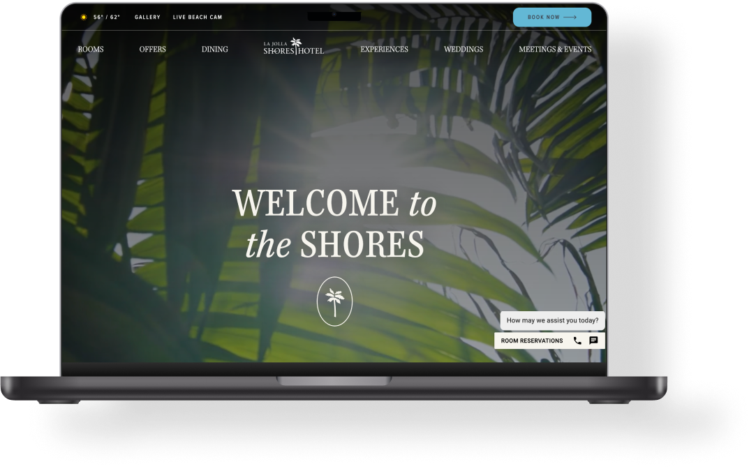 A laptop showing the homepage of the Shores Hotel's website.